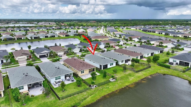 521 SE Plumeria Dr, Port Saint Lucie, FL 34984 - aerial perspective of suburban area featuring a nearby body of water