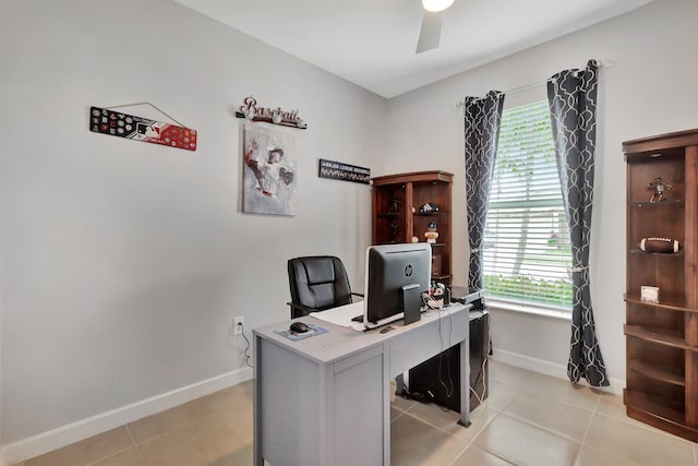 521 SE Plumeria Dr, Port Saint Lucie, FL 34984 - office area featuring ceiling fan, plenty of natural light, and light tile patterned flooring