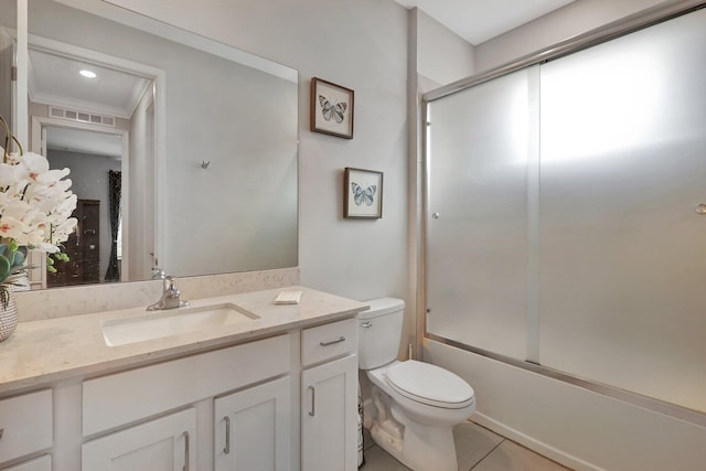 521 SE Plumeria Dr, Port Saint Lucie, FL 34984 - bathroom with vanity, tile patterned floors, enclosed tub / shower combo, and ornamental molding