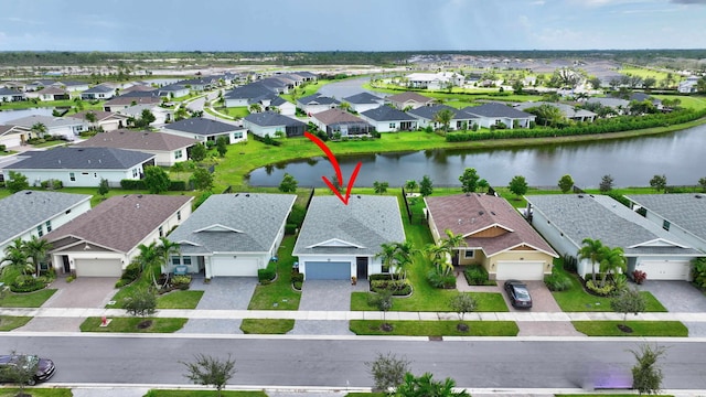 521 SE Plumeria Dr, Port Saint Lucie, FL 34984 - aerial view of residential area featuring a nearby body of water