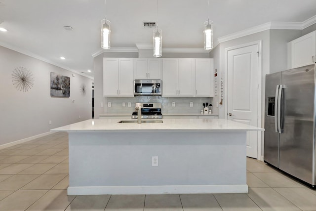 521 SE Plumeria Dr, Port Saint Lucie, FL 34984 - kitchen featuring stainless steel appliances, crown molding, backsplash, light countertops, and white cabinetry