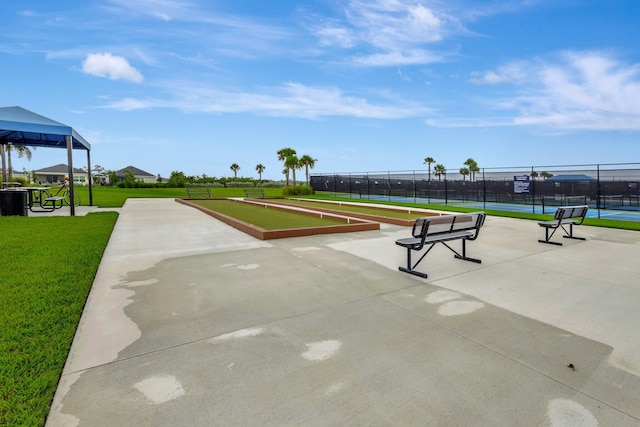521 SE Plumeria Dr, Port Saint Lucie, FL 34984 - view of home's community featuring a game area and a tennis court