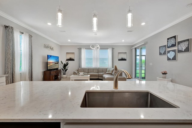 521 SE Plumeria Dr, Port Saint Lucie, FL 34984 - kitchen featuring open floor plan, healthy amount of natural light, light stone counters, crown molding, and pendant lighting