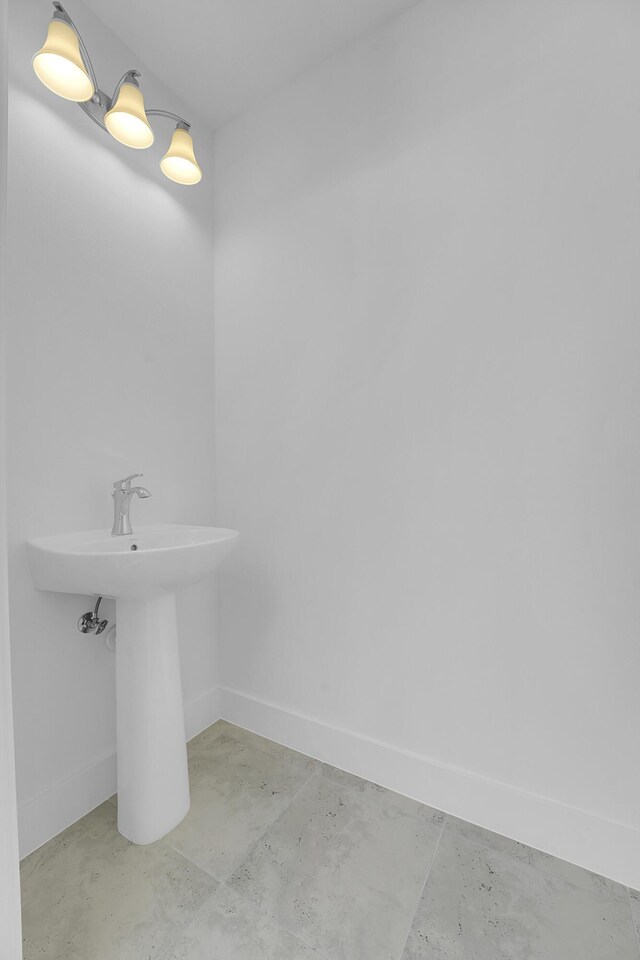 13496 Bernoulli Way, Palm Beach Gardens, FL 33418 - bathroom with concrete floors and baseboards