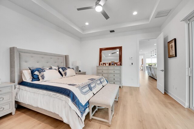 13496 Bernoulli Way, Palm Beach Gardens, FL 33418 - bedroom featuring a raised ceiling, light wood-style floors, recessed lighting, and a ceiling fan