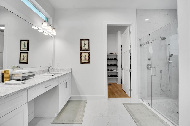 13496 Bernoulli Way, Palm Beach Gardens, FL 33418 - bathroom featuring vanity, a shower stall, a spacious closet, and tile patterned flooring