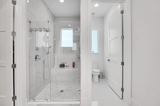 13496 Bernoulli Way, Palm Beach Gardens, FL 33418 - bathroom with a marble finish shower, recessed lighting, and marble finish flooring