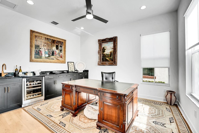 13496 Bernoulli Way, Palm Beach Gardens, FL 33418 - office area featuring wine cooler, wet bar, a ceiling fan, recessed lighting, and light wood-style floors