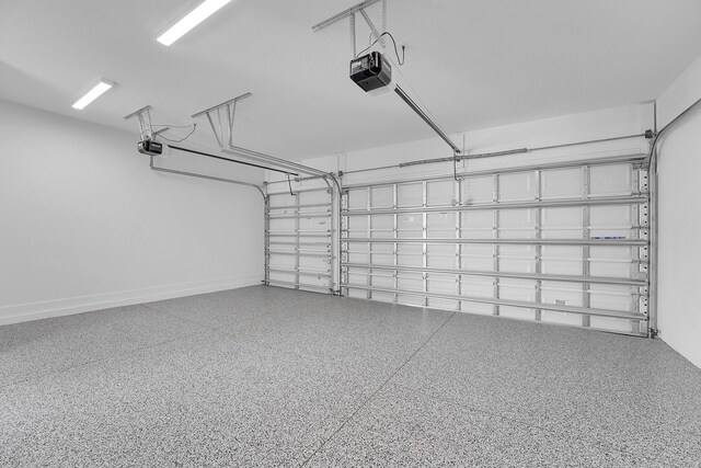 13496 Bernoulli Way, Palm Beach Gardens, FL 33418 - garage featuring a garage door opener