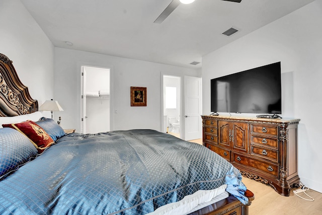 13496 Bernoulli Way, Palm Beach Gardens, FL 33418 - bedroom with wood finished floors, ceiling fan, ensuite bathroom, and a walk in closet