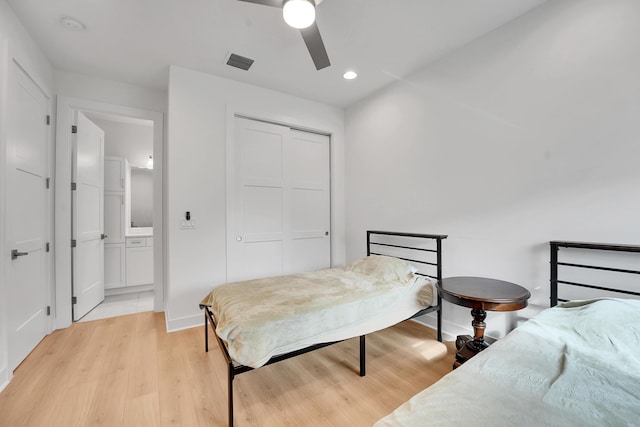 13496 Bernoulli Way, Palm Beach Gardens, FL 33418 - bedroom featuring light wood-type flooring, a closet, recessed lighting, ceiling fan, and ensuite bath