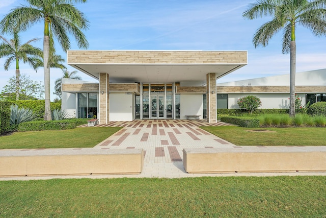13496 Bernoulli Way, Palm Beach Gardens, FL 33418 - rear view of property with a yard