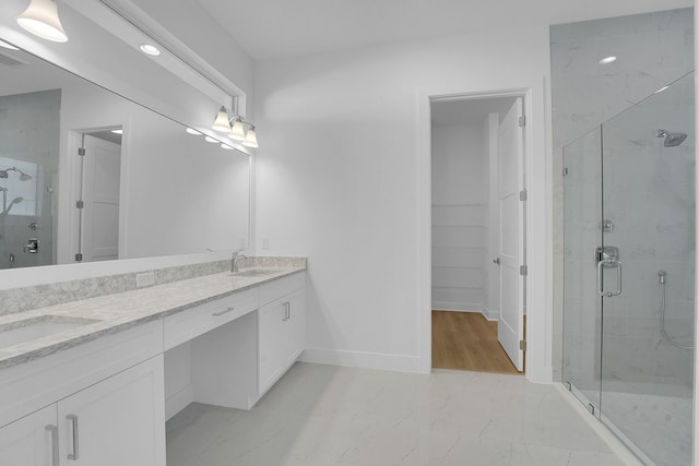 13496 Bernoulli Way, Palm Beach Gardens, FL 33418 - bathroom with double vanity, a stall shower, marble look tile flooring, recessed lighting, and a spacious closet