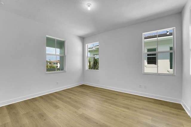13496 Bernoulli Way, Palm Beach Gardens, FL 33418 - spare room with light wood-type flooring and baseboards