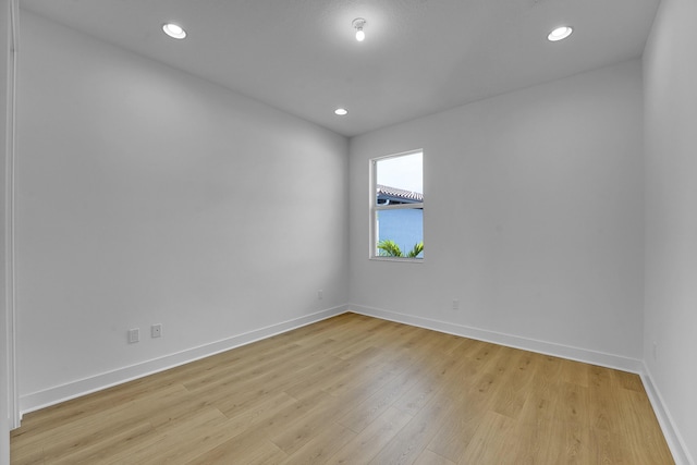 13496 Bernoulli Way, Palm Beach Gardens, FL 33418 - unfurnished room with light wood-type flooring and recessed lighting
