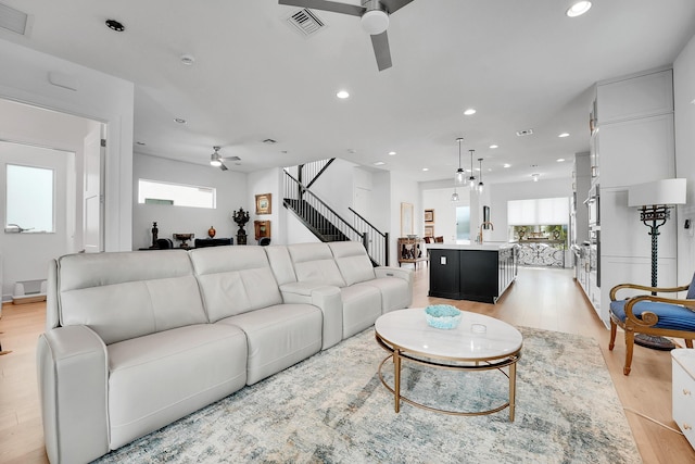 13496 Bernoulli Way, Palm Beach Gardens, FL 33418 - living area with a ceiling fan, light wood-style flooring, healthy amount of natural light, and recessed lighting