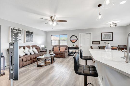 313 Saxony Unit G, Delray Beach, FL 33446 - living room with a ceiling fan and light wood finished floors