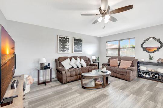 313 Saxony Unit G, Delray Beach, FL 33446 - living room with a ceiling fan and wood finished floors