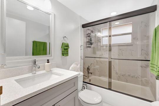 313 Saxony Unit G, Delray Beach, FL 33446 - full bath featuring vanity and combined bath / shower with glass door
