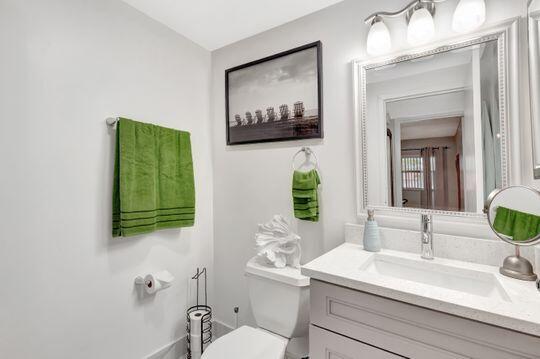 313 Saxony Unit G, Delray Beach, FL 33446 - bathroom featuring vanity and toilet