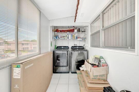 313 Saxony Unit G, Delray Beach, FL 33446 - laundry room with independent washer and dryer and tile patterned flooring