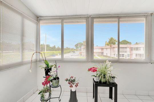 313 Saxony Unit G, Delray Beach, FL 33446 - unfurnished sunroom with tile patterned floors