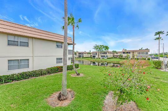 313 Saxony Unit G, Delray Beach, FL 33446 - view of grassy yard featuring a water view