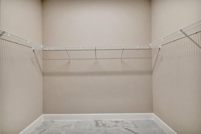 11535 SW Surf Springs Rd, Port Saint Lucie, FL 34987 - full bathroom with vanity, a marble finish shower, recessed lighting, and marble finish flooring