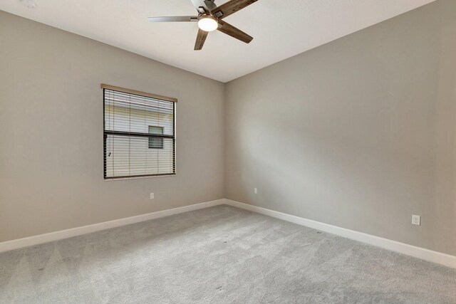 11535 SW Surf Springs Rd, Port Saint Lucie, FL 34987 - unfurnished bedroom featuring light carpet, a walk in closet, and ceiling fan