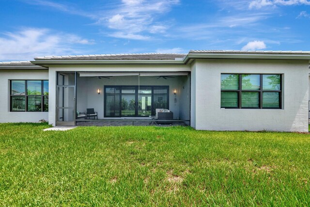 11535 SW Surf Springs Rd, Port Saint Lucie, FL 34987 - back of house with a sunroom and stucco siding