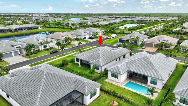 11535 SW Surf Springs Rd, Port Saint Lucie, FL 34987 - aerial perspective of suburban area featuring a nearby body of water