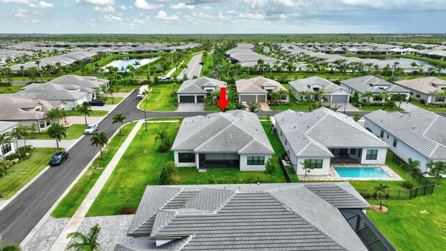 11535 SW Surf Springs Rd, Port Saint Lucie, FL 34987 - aerial perspective of suburban area with a large body of water