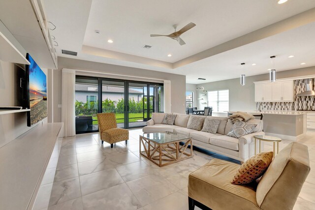 11535 SW Surf Springs Rd, Port Saint Lucie, FL 34987 - living room with french doors, light marble finish floors, recessed lighting, and a ceiling fan