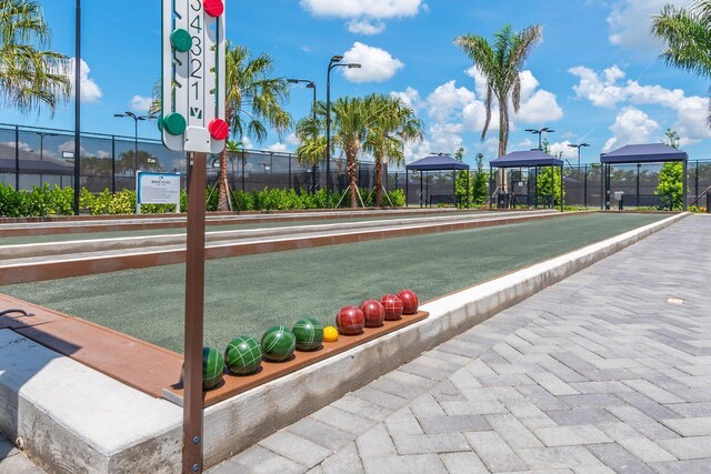 11535 SW Surf Springs Rd, Port Saint Lucie, FL 34987 - view of patio featuring a fire pit and a ceiling fan