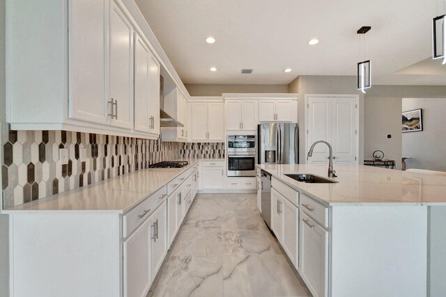 11535 SW Surf Springs Rd, Port Saint Lucie, FL 34987 - kitchen with stainless steel fridge, light marble finish flooring, wall chimney exhaust hood, tasteful backsplash, and white cabinetry