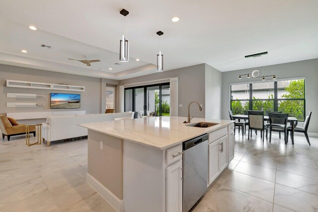 11535 SW Surf Springs Rd, Port Saint Lucie, FL 34987 - kitchen featuring appliances with stainless steel finishes, white cabinets, light marble finish flooring, recessed lighting, and tasteful backsplash