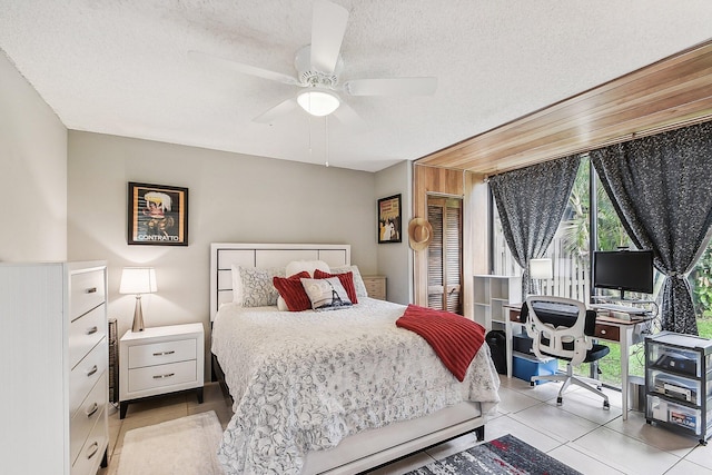11063 Oakdale Rd, Boynton Beach, FL 33437 - bedroom featuring multiple windows, a textured ceiling, an office area, light tile patterned floors, and a ceiling fan