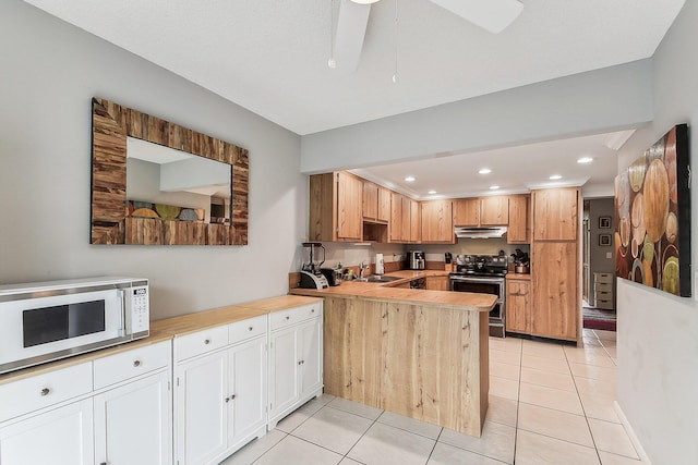 11063 Oakdale Rd, Boynton Beach, FL 33437 - kitchen with electric stove, white microwave, under cabinet range hood, light countertops, and recessed lighting