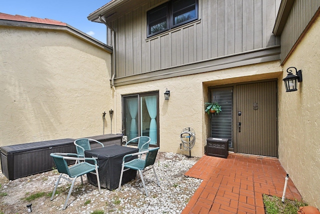 11063 Oakdale Rd, Boynton Beach, FL 33437 - entrance to property with stucco siding and a patio