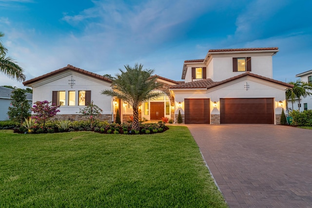 3153 SW Pond Apple St, Palm City, FL 34990 - mediterranean / spanish-style house featuring stucco siding, stone siding, decorative driveway, a tiled roof, and a front yard