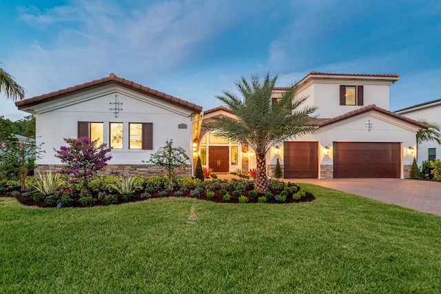 3153 SW Pond Apple St, Palm City, FL 34990 - mediterranean / spanish house with stucco siding, driveway, a tile roof, and a front lawn