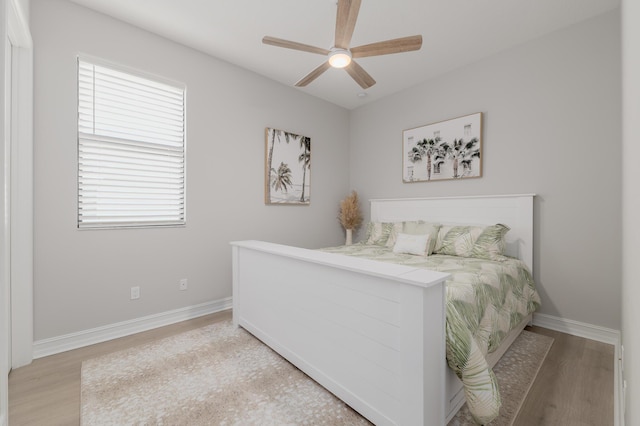 3153 SW Pond Apple St, Palm City, FL 34990 - bedroom featuring light wood-type flooring, multiple windows, and ceiling fan