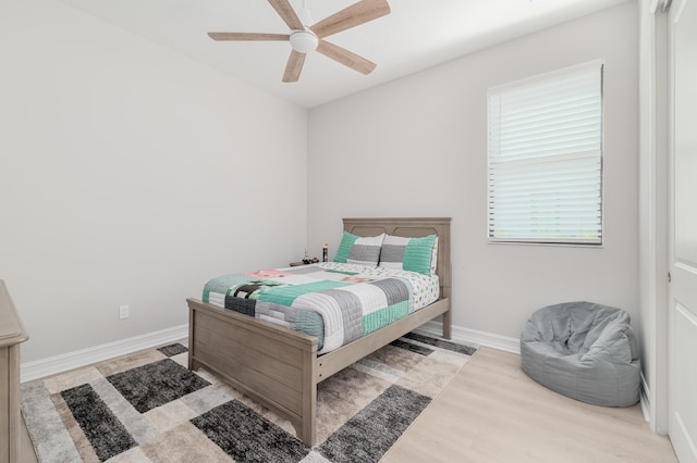 3153 SW Pond Apple St, Palm City, FL 34990 - bedroom with wood finished floors and ceiling fan