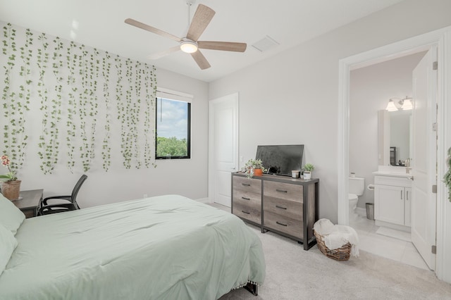 3153 SW Pond Apple St, Palm City, FL 34990 - bedroom featuring light colored carpet, ensuite bathroom, and ceiling fan