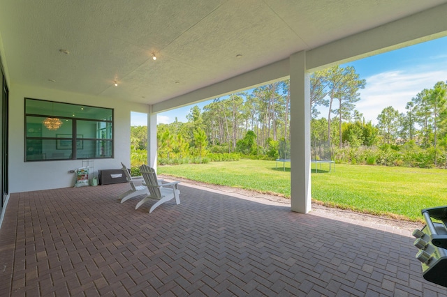 3153 SW Pond Apple St, Palm City, FL 34990 - view of patio / terrace with a trampoline