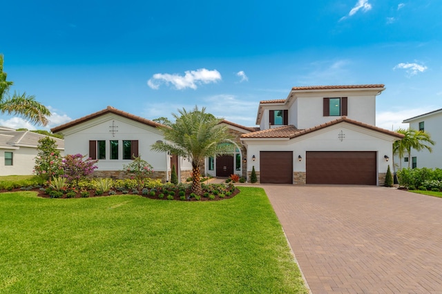 3153 SW Pond Apple St, Palm City, FL 34990 - mediterranean / spanish house with stone siding, stucco siding, decorative driveway, a front yard, and a tile roof