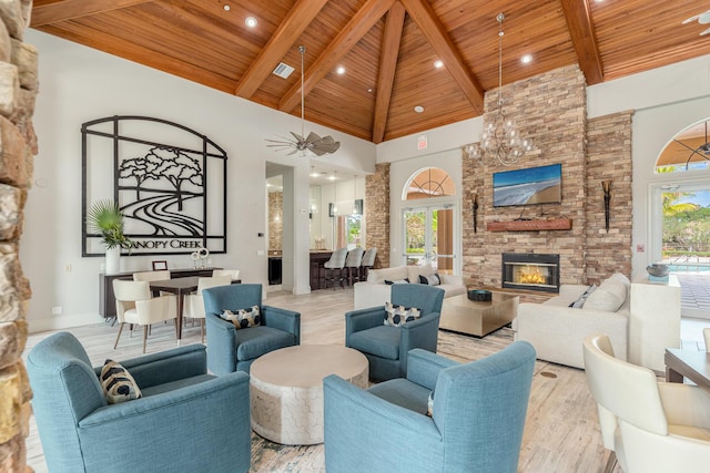 3153 SW Pond Apple St, Palm City, FL 34990 - living area featuring a wood ceiling with exposed beams, a fireplace, high vaulted ceiling, wood finished floors, and ceiling fan