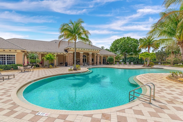 3153 SW Pond Apple St, Palm City, FL 34990 - community pool with a patio area