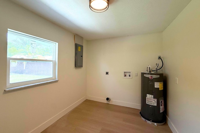 216 SE Fallon Dr, Port Saint Lucie, FL 34983 - washroom with water heater, hookup for an electric dryer, light wood-style floors, electric panel, and hookup for a washing machine