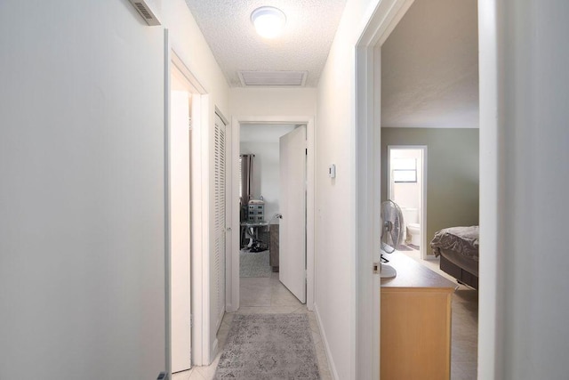 1967 SW Ember St, Port Saint Lucie, FL 34953 - corridor featuring light tile patterned flooring